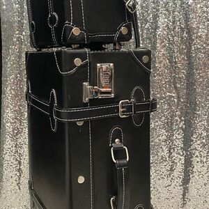 Black Travel Bag with Silver Hardware and Boxy Shape